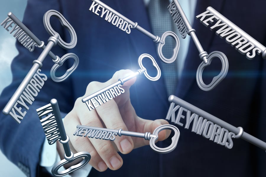 Keys floating around a pointing finger representing keywords for SEO www.paladindigitalmarketing.com